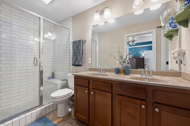 bathroom with walk in shower, tile patterned floors, toilet, and vanity