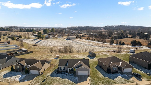 birds eye view of property with a rural view