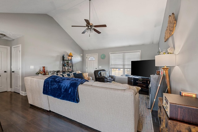 living room featuring dark wood-type flooring, ceiling fan, and vaulted ceiling