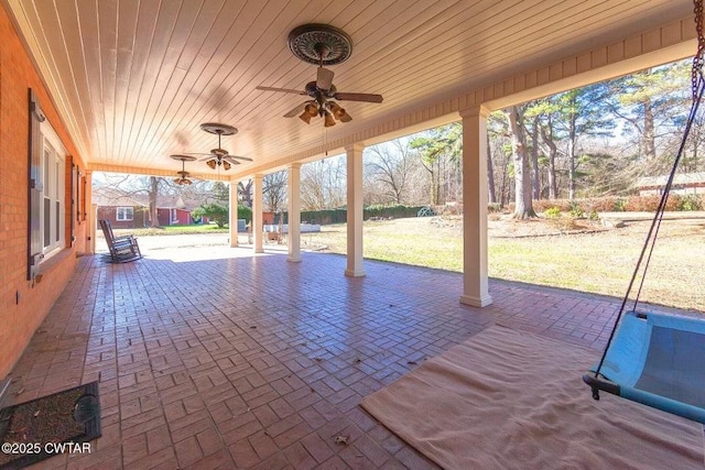 view of patio featuring ceiling fan