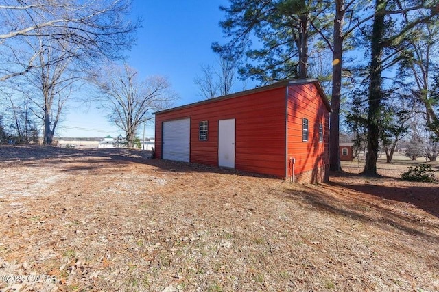 view of outbuilding with a garage