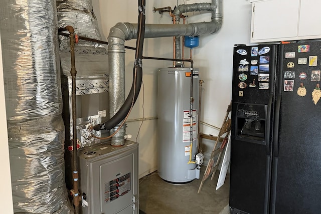 utility room featuring water heater