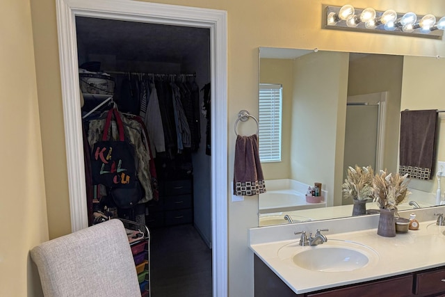 bathroom featuring vanity and shower with separate bathtub