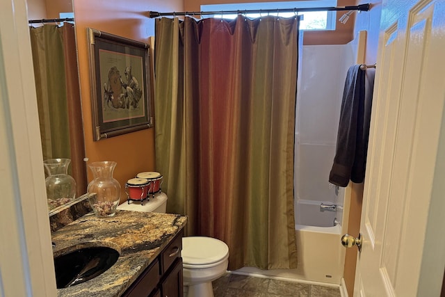 full bathroom featuring vanity, shower / bath combo with shower curtain, and toilet