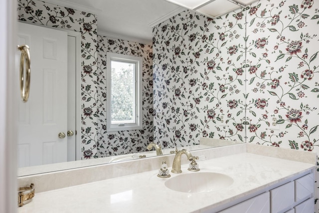 bathroom with vanity and crown molding