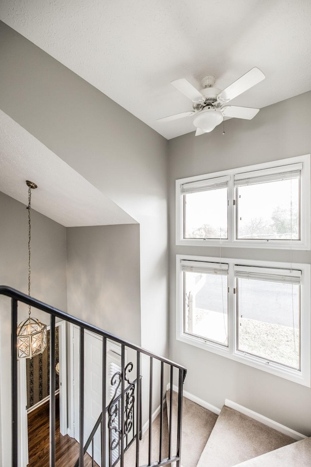 staircase with ceiling fan