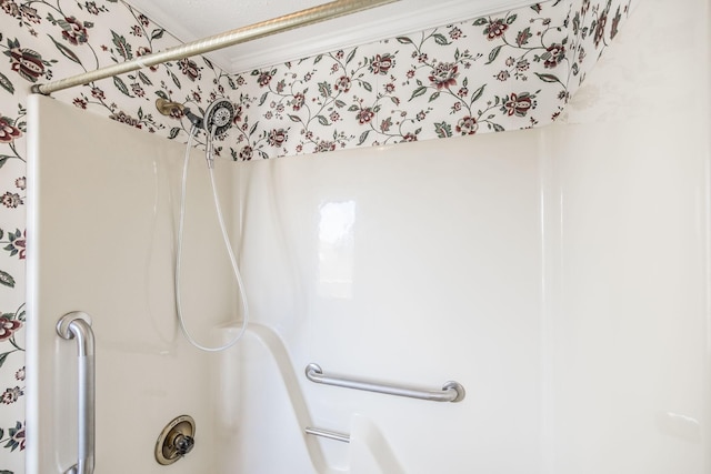 bathroom featuring bathing tub / shower combination and crown molding