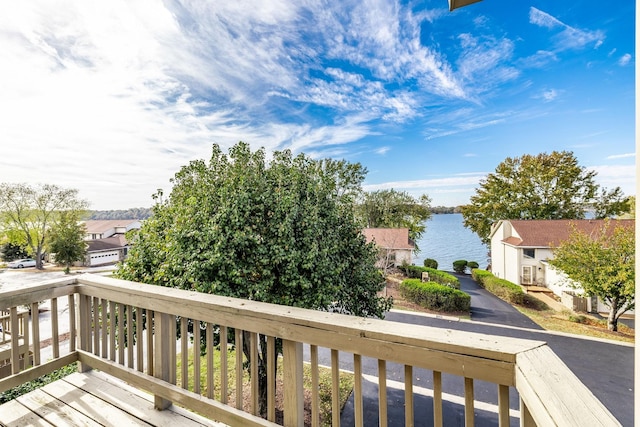 wooden deck with a water view