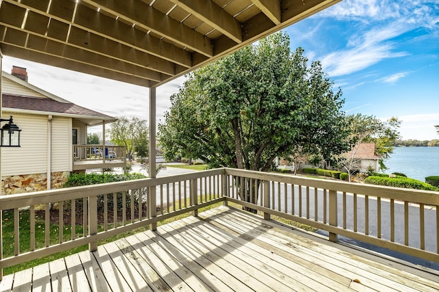 wooden deck featuring a water view