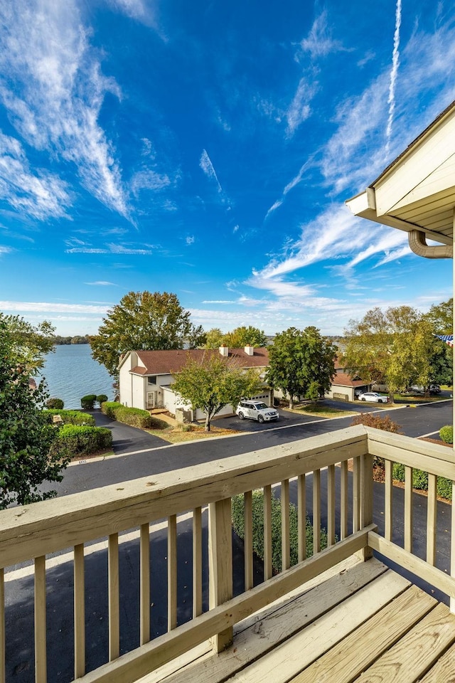 wooden deck with a water view