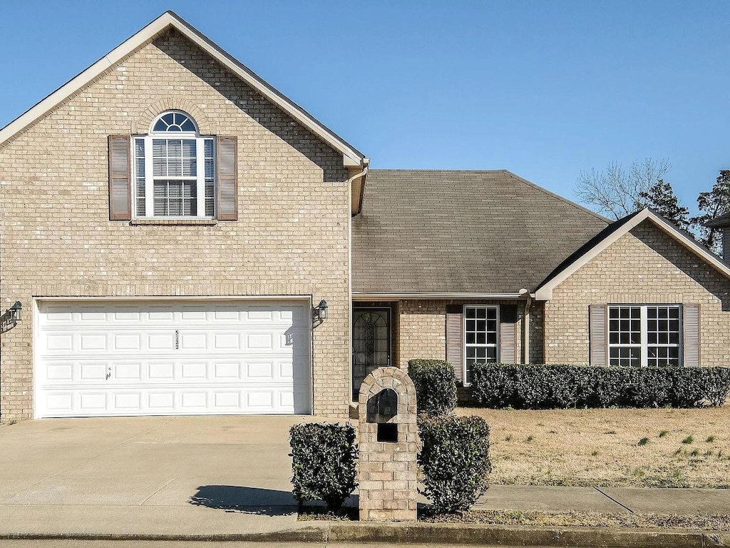 front of property with a garage