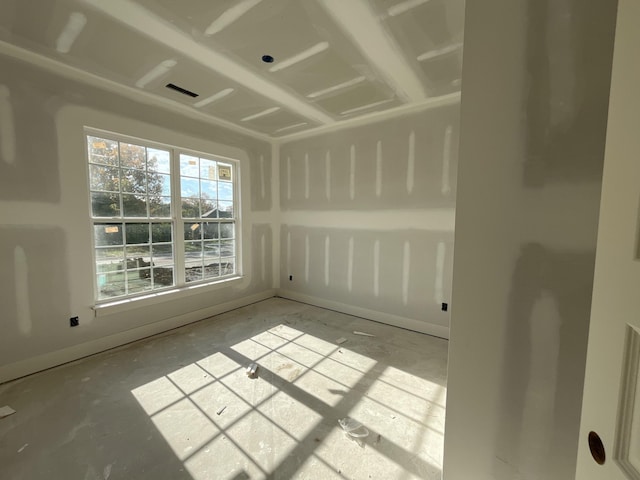 spare room featuring concrete flooring