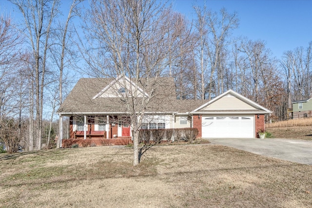 view of front of house with a garage, a front lawn, and a porch