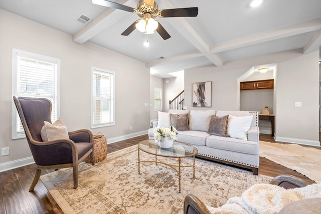 living room with beamed ceiling, wood-type flooring, coffered ceiling, and ceiling fan