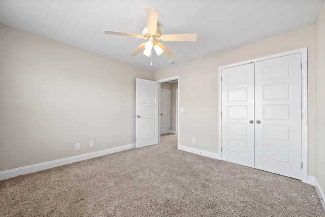 unfurnished bedroom with a closet, ceiling fan, and carpet