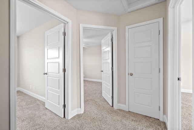 hallway with light carpet