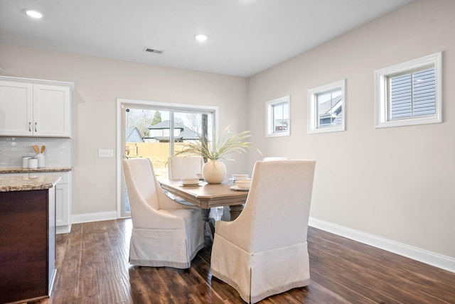 dining room featuring dark wood-type flooring