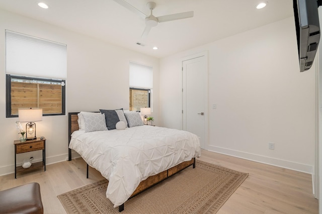 bedroom featuring light hardwood / wood-style flooring and ceiling fan