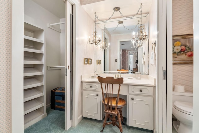 bathroom featuring vanity, crown molding, and toilet