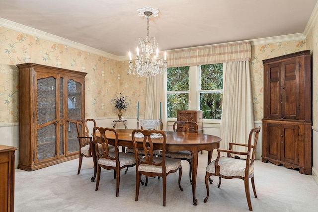 carpeted dining room featuring crown molding and a chandelier