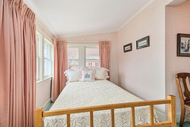 bedroom with vaulted ceiling and ornamental molding