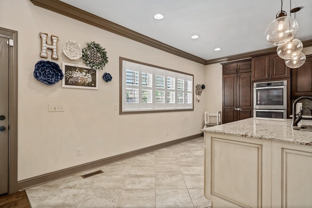 kitchen featuring dark brown cabinetry, sink, crown molding, light stone counters, and double oven