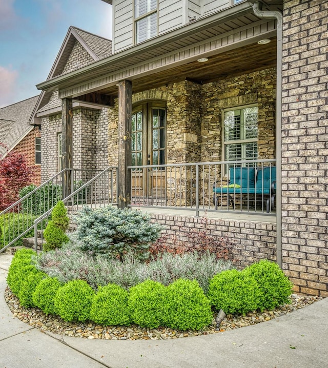 view of exterior entry featuring a porch