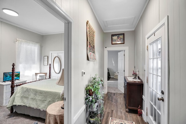 bedroom with crown molding and wood-type flooring