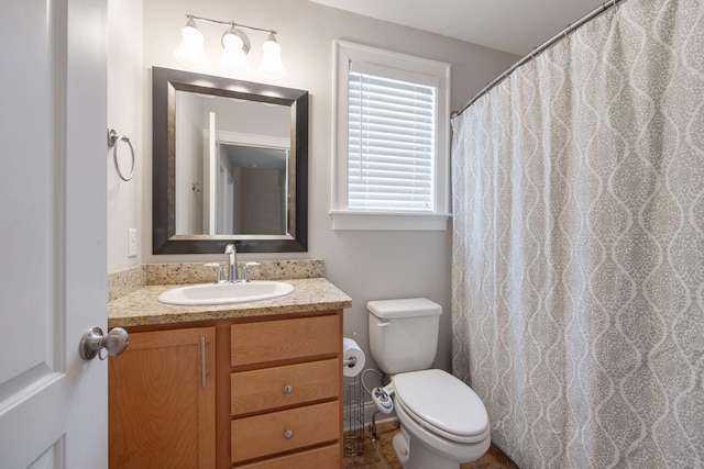 full bathroom featuring toilet and vanity