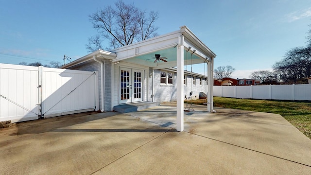 back of house featuring a patio area, french doors, and ceiling fan