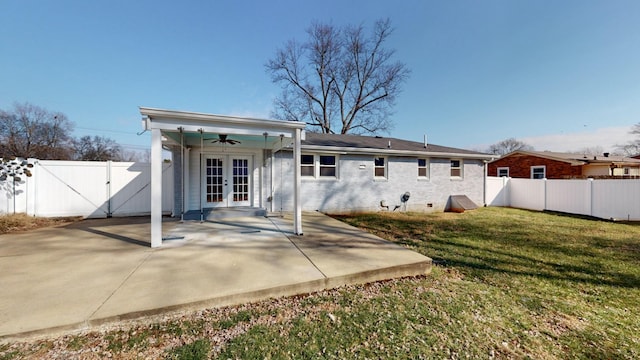 back of house with a patio, a yard, french doors, and ceiling fan