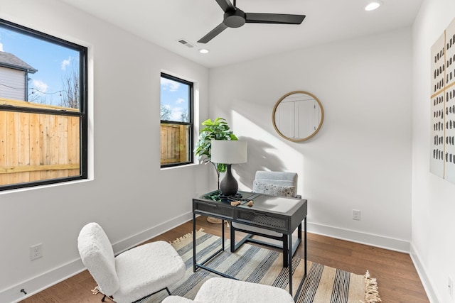 office with hardwood / wood-style flooring and ceiling fan