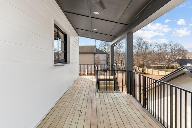 wooden deck featuring ceiling fan