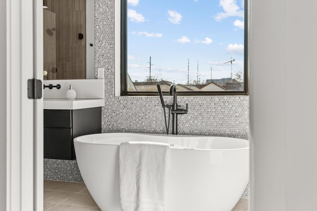 bathroom featuring a bathing tub and tile patterned flooring