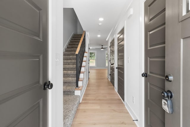 corridor with light wood-type flooring