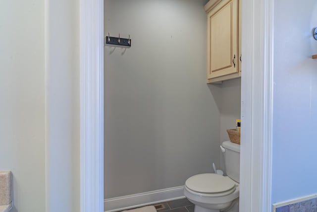 bathroom featuring tile patterned floors and toilet