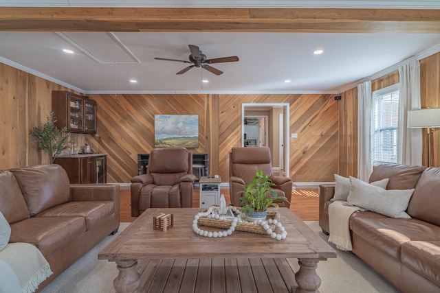 living room with crown molding and ceiling fan