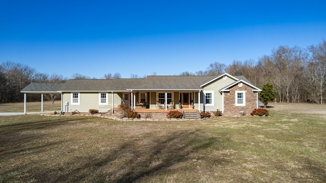 single story home with a carport, covered porch, and a front yard