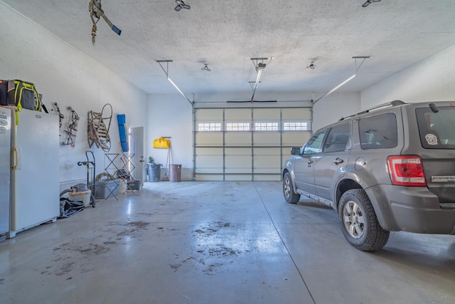 garage featuring white fridge