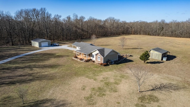 birds eye view of property with a rural view