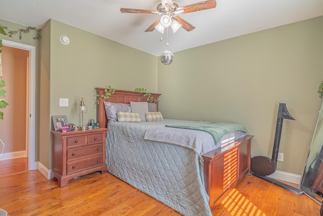 bedroom featuring ceiling fan and light hardwood / wood-style flooring