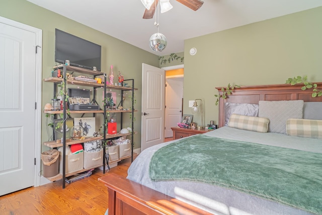 bedroom with hardwood / wood-style flooring and ceiling fan