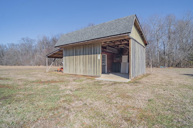 view of outbuilding with a lawn