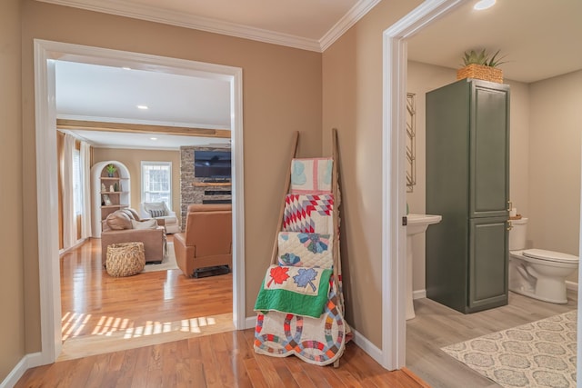 interior space featuring hardwood / wood-style floors and ornamental molding