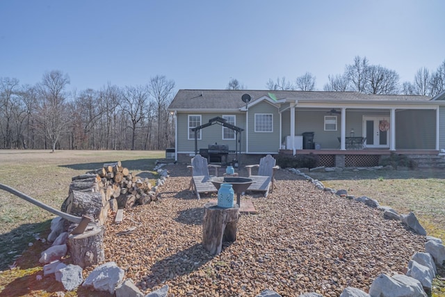 view of front of house with a front yard and french doors