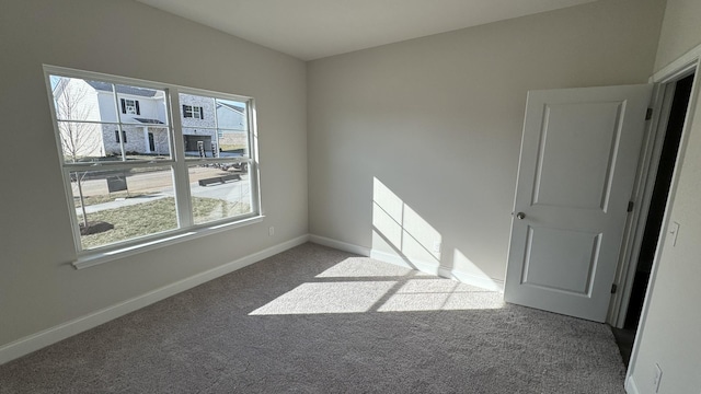 spare room featuring carpet floors