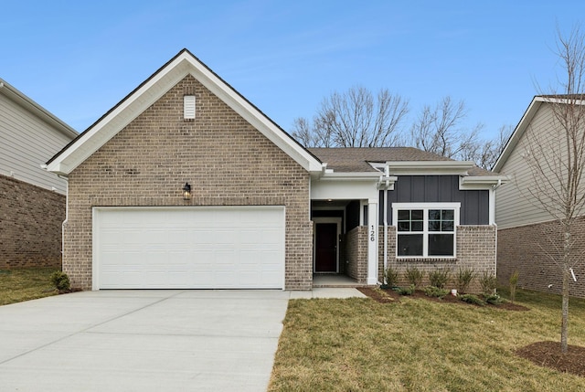 view of front of home with a garage and a front yard