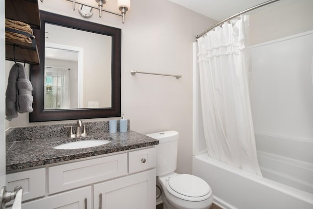 full bath featuring shower / bathtub combination with curtain, toilet, and vanity