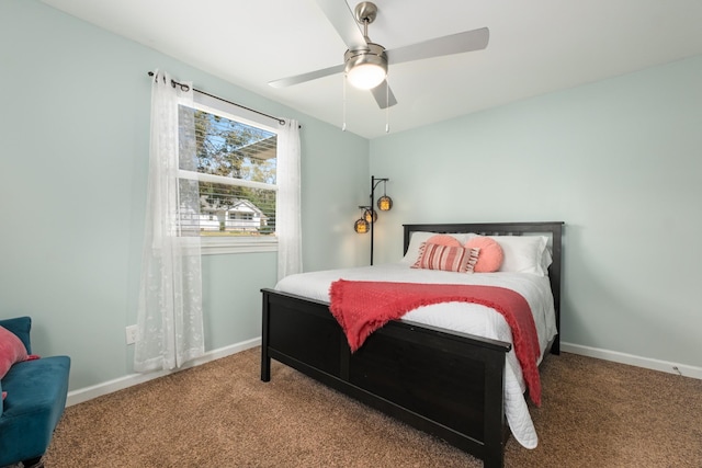 carpeted bedroom featuring ceiling fan and baseboards