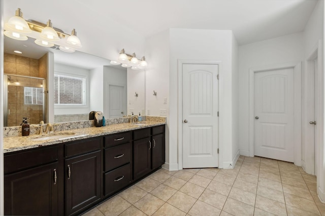 bathroom with tile patterned flooring, an enclosed shower, and vanity